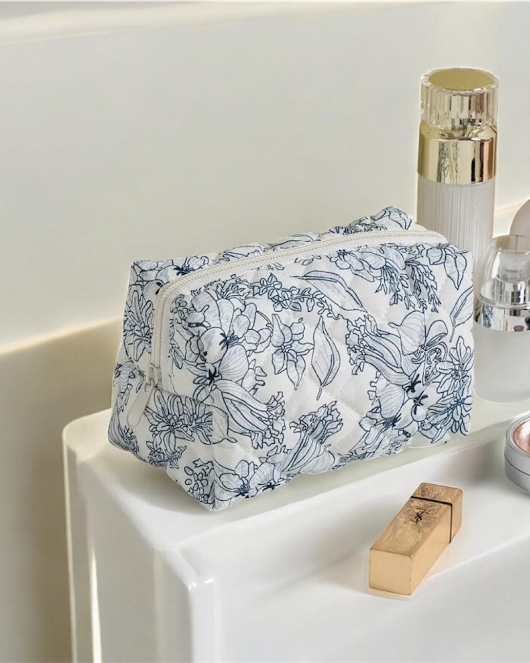 Quilted blue cosmetic pouch